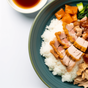Delicious Chinese-style pork with rice, enhanced with peppers, mushrooms, and bamboo shoots, cooked with soy sauce, wine vinegar, curry, and milk. An exotic dish that brings oriental flavors to the table, with a crunchy twist of roughly chopped roasted cashews. Enjoy!